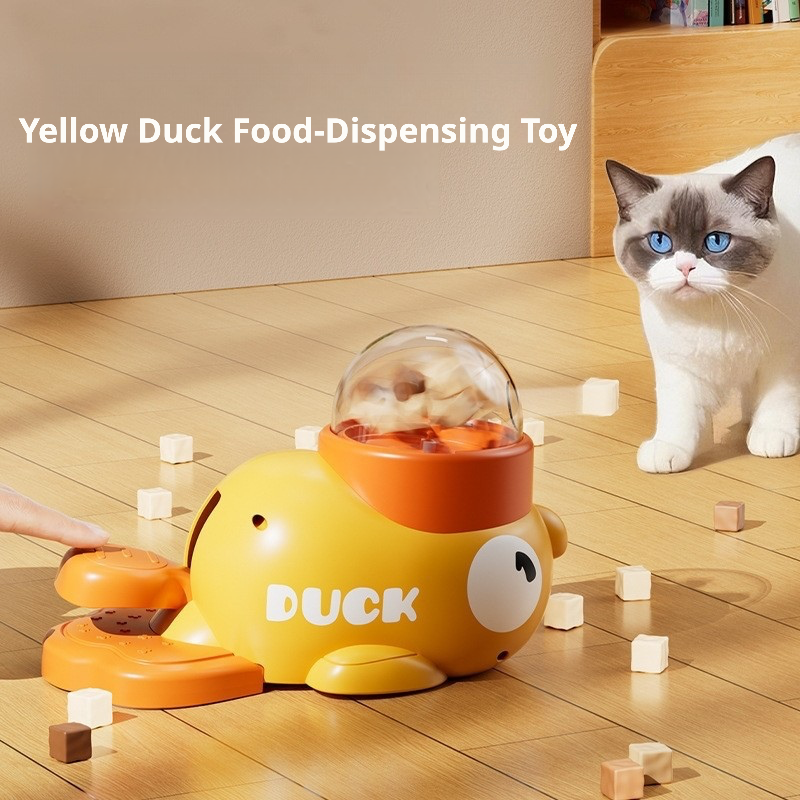 A playful yellow duck-shaped pet treat dispenser designed to hold pellet-type treats or cat food. When activated by a gentle press, it releases snacks randomly, encouraging interactive play and mental stimulation for cats and dogs. The transparent dome allows visibility of remaining treats, while the ergonomic design ensures safe, slow feeding to prevent choking or overeating. Ideal for keeping pets engaged and reducing loneliness during alone time.