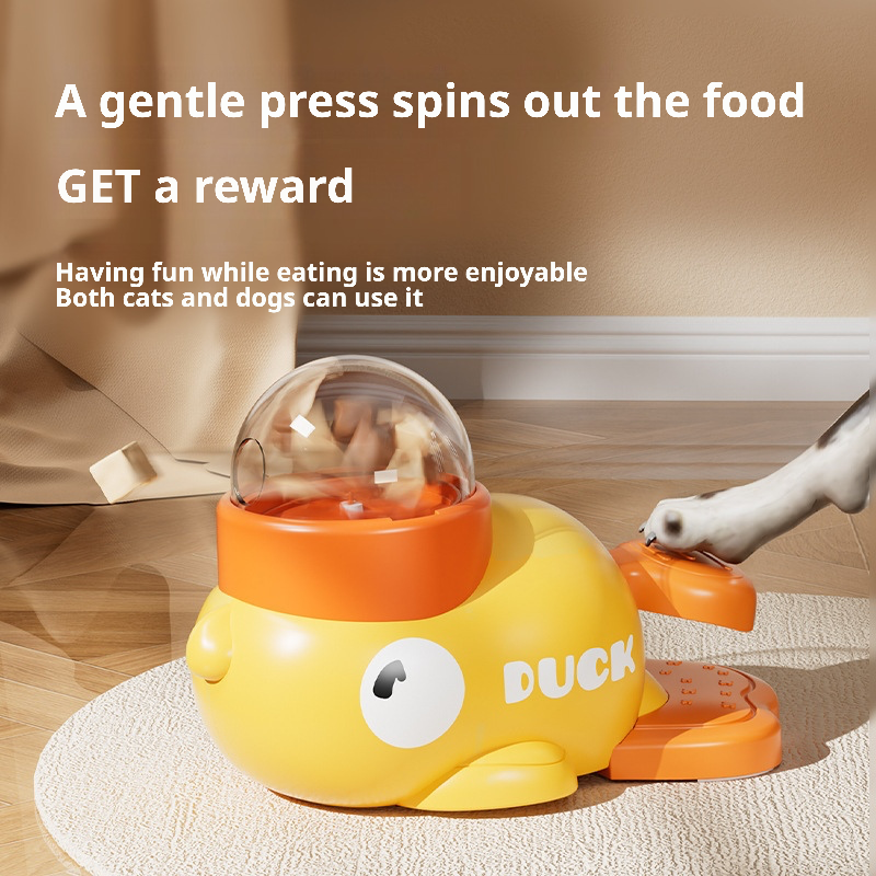 A playful yellow duck-shaped pet treat dispenser designed to hold pellet-type treats or cat food. When activated by a gentle press, it releases snacks randomly, encouraging interactive play and mental stimulation for cats and dogs. The transparent dome allows visibility of remaining treats, while the ergonomic design ensures safe, slow feeding to prevent choking or overeating. Ideal for keeping pets engaged and reducing loneliness during alone time.