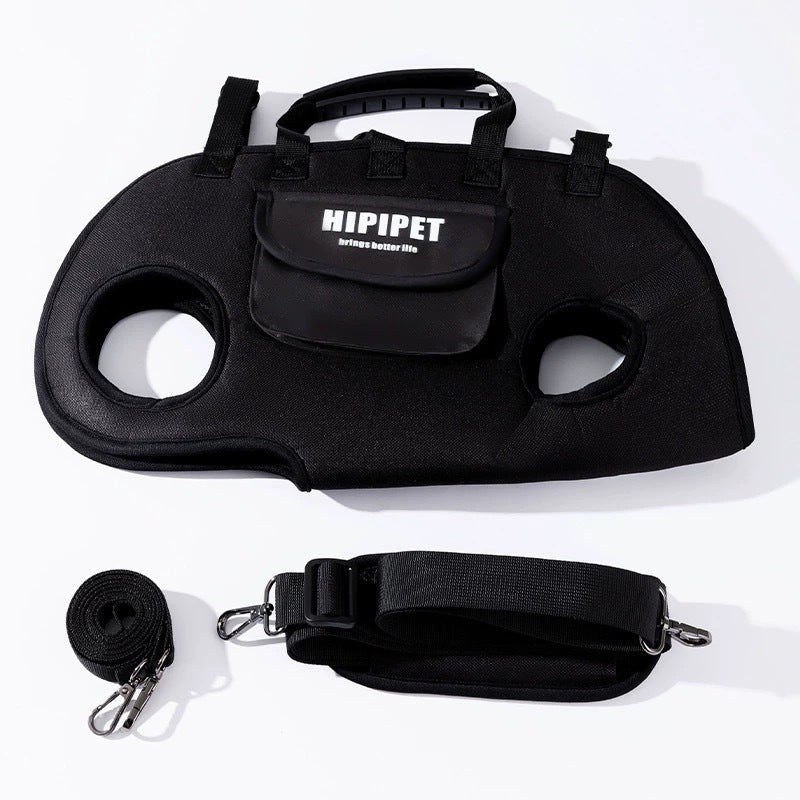 A versatile HIPIPET pet carrier designed for small dogs and cats, featuring a crossbody sling style with multiple carrying options — hand-held, shoulder-strapped, or worn across the body. The black canvas body includes a front pocket with brand logo for storing treats or essentials, while the included adjustable harness and leash ensure secure attachment during transit. Ideal for vet visits, park outings, or travel, this lightweight bag prioritizes comfort and safety.