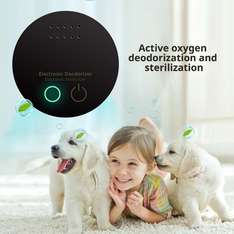 An electronic pet deodorizer using active oxygen technology to eliminate odors and sterilize the air. The sleek black circular device features a power button and indicator light, designed for safe use around children and pets. The accompanying scene shows a joyful girl playing with two golden retriever puppies on a clean carpet, emphasizing a fresh, healthy home environment free from pet-related smells.